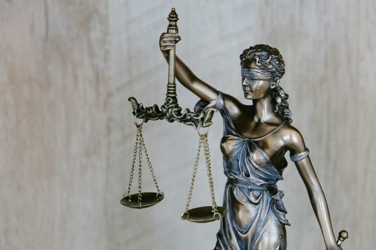 Law books and a gavel, suggesting compliance and regulatory monitoring.