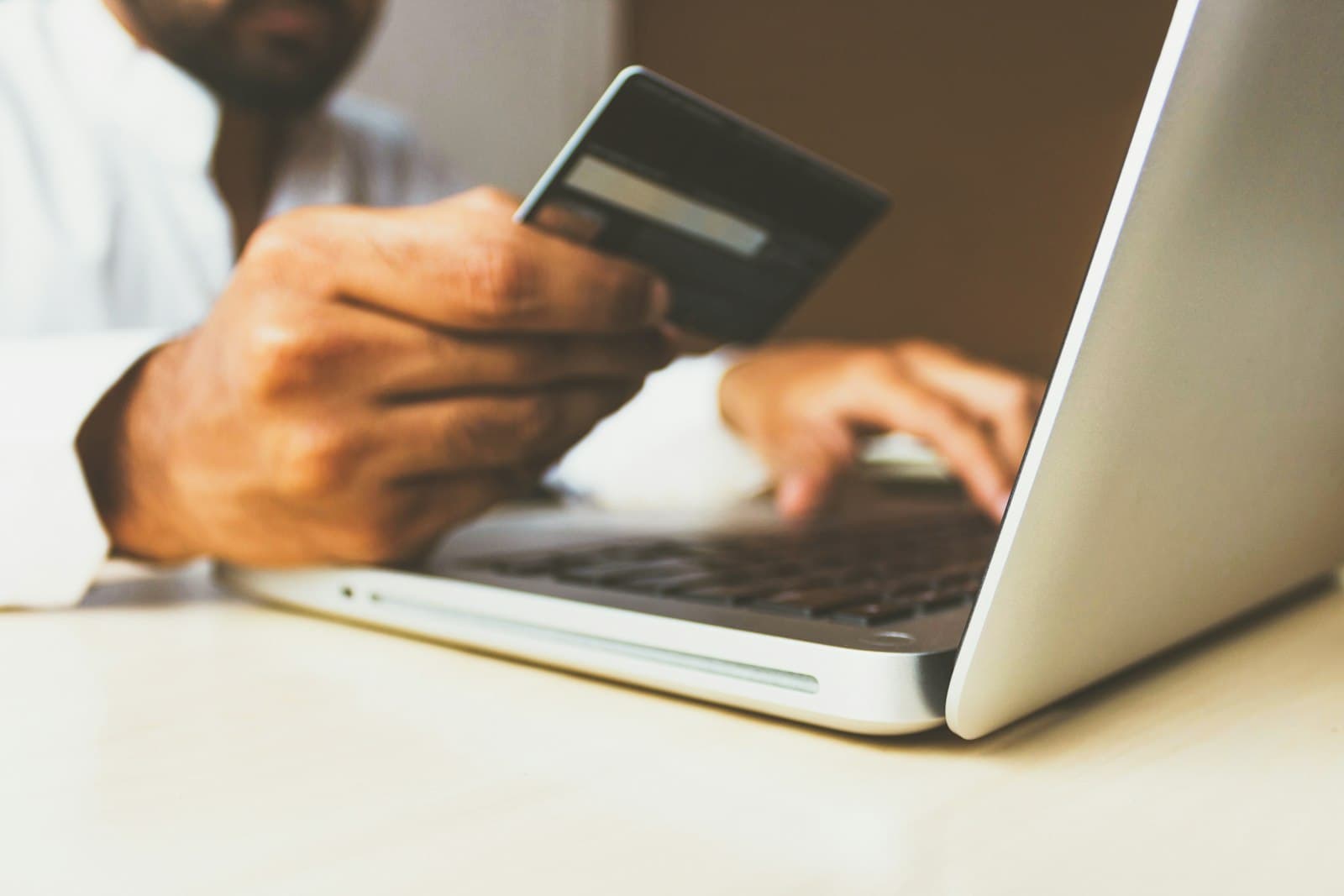 Hands using a smartphone for a digital payment, suggesting instant settlement flows.